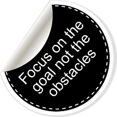 Image showing Focus on the goal not the obstacles. Inspirational motivational quote. Simple trendy design. Black and white stickers. 