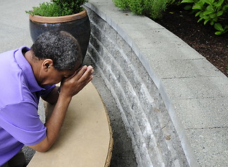 Image showing African american male  praying.