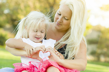 Image showing Little Girl With Mother Making Heart Shape with Hands