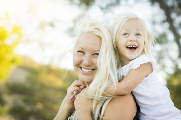 Image showing Mother and Little Girl Having Fun Together in Grass