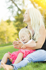 Image showing Mother and Little Girl Having Fun Together in Grass