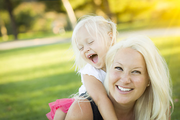 Image showing Mother and Little Girl Having Fun Together in Grass