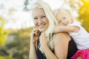 Image showing Mother and Little Girl Having Fun Together in Grass