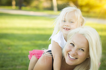 Image showing Mother and Little Girl Having Fun Together in Grass