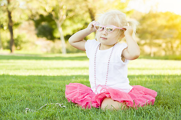 Image showing Little Girl Playing Dress Up With Pink Glasses and Necklace