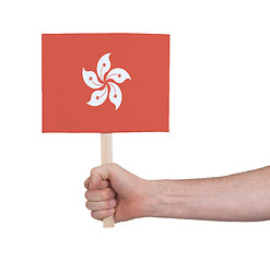 Image showing Hand holding small card - Flag of Hong Kong