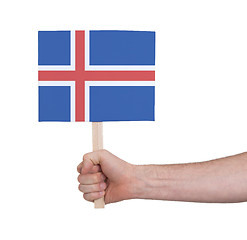 Image showing Hand holding small card - Flag of Iceland