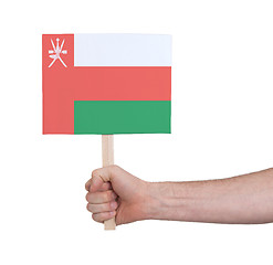 Image showing Hand holding small card - Flag of Oman