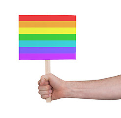 Image showing Hand holding small card - Flag of Rainbow flag