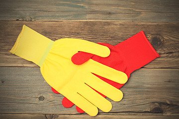 Image showing handshake red and yellow construction gloves