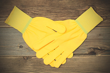 Image showing handshake yellow construction gloves