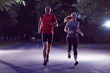 Image showing couple jogging at early morning