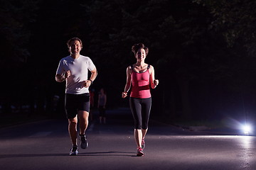 Image showing couple jogging at early morning