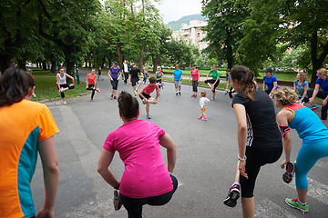 Image showing jogging people group stretching