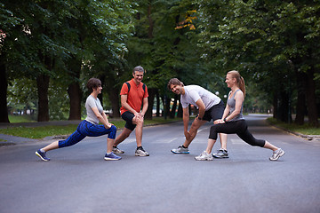 Image showing jogging people group stretching