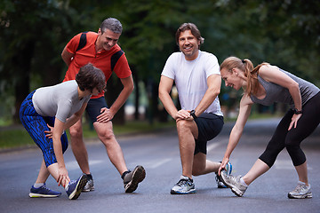 Image showing jogging people group stretching