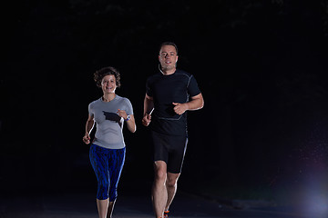 Image showing couple jogging at early morning