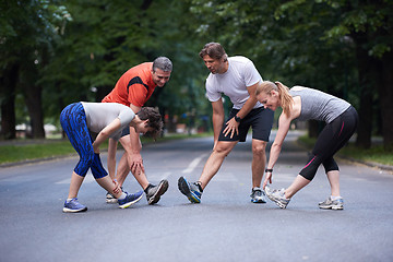 Image showing jogging people group stretching