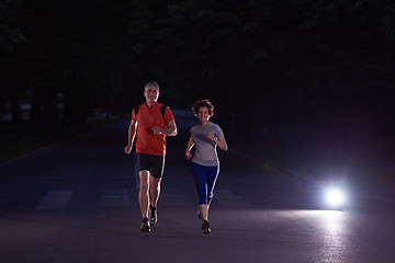 Image showing couple jogging at early morning