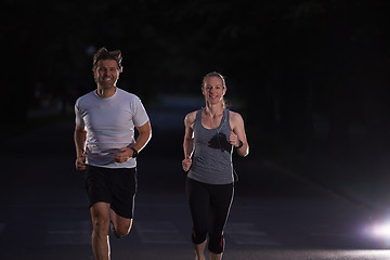 Image showing couple jogging at early morning