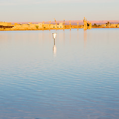 Image showing sunshine in the lake yellow  desert of morocco sand and     dune