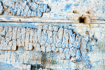 Image showing metal nail dirty stripped paint in blue