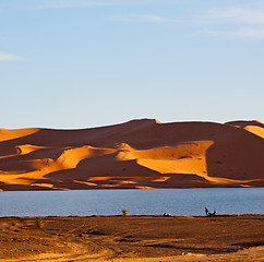 Image showing sunshine in the lake yellow  desert of morocco sand and     dune