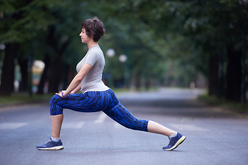 Image showing woman  stretching before morning jogging