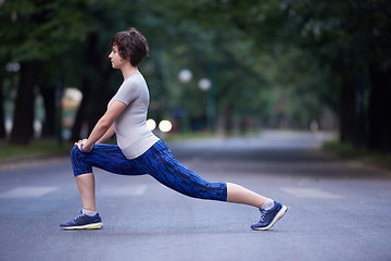 Image showing woman  stretching before morning jogging