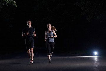 Image showing couple jogging at early morning