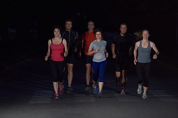 Image showing people group jogging at night