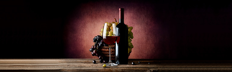 Image showing Wine with grape in basket