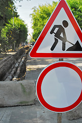 Image showing Road signs in street under reconstruction