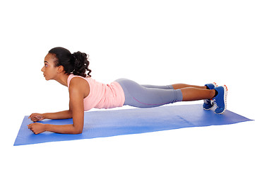 Image showing Beautiful african american woman exercising.