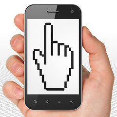 Image showing Web design concept: Hand Holding Smartphone with Mouse Cursor on display