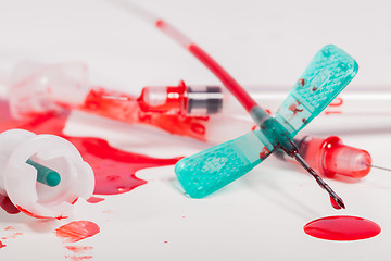 Image showing Syringes and IV Lines Covered with Blood