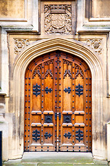 Image showing parliament in london door and marble antique   