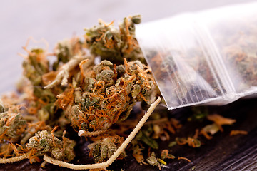 Image showing Close up Dried Marijuana Leaves on the Table