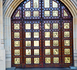 Image showing parliament in london old church door and marble antique  wall