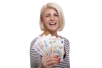 Image showing Smiling woman holding a handful of Euro notes