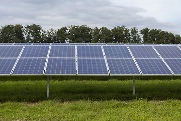 Image showing Field with blue siliciom solar cells alternative energy