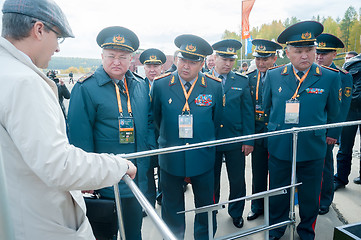 Image showing Officers of Kazakh army examine troop-carrier