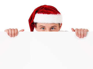 Image showing Young man in Santa hat