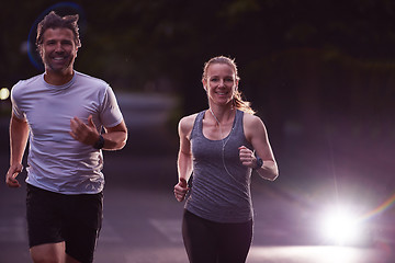 Image showing couple jogging at early morning