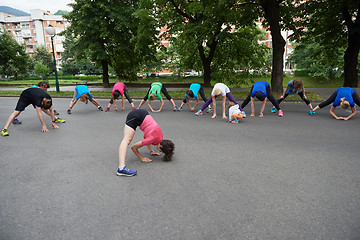 Image showing jogging people group stretching