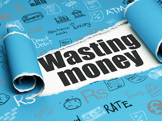 Image showing Money concept: black text Wasting Money under the piece of  torn paper