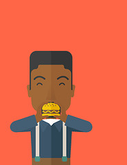 Image showing Man eating hamburger. 