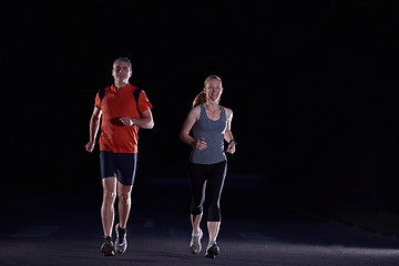 Image showing couple jogging at early morning