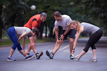 Image showing jogging people group stretching