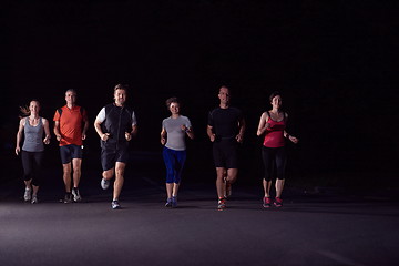 Image showing people group jogging at night